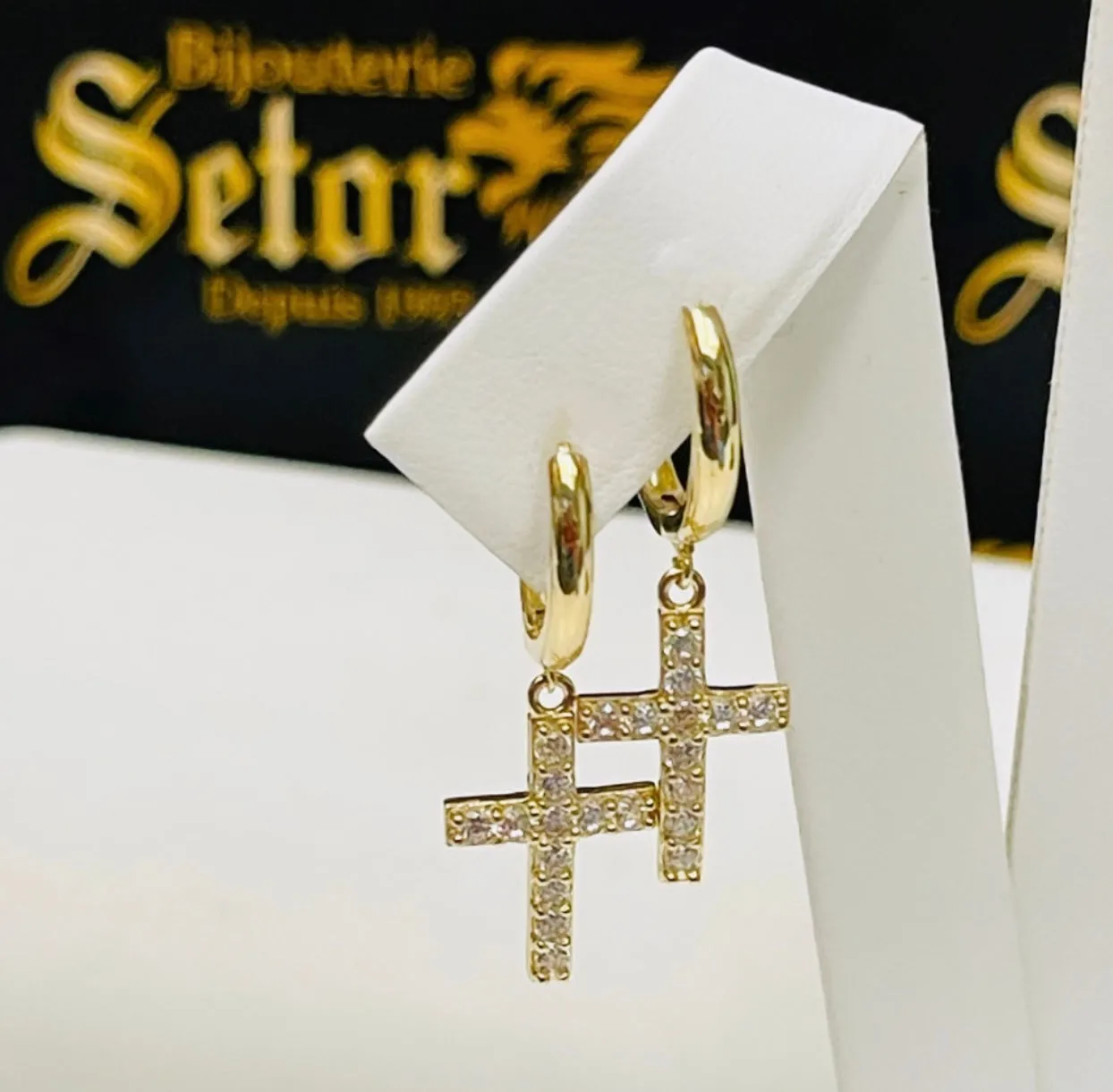 Dangling cross earrings